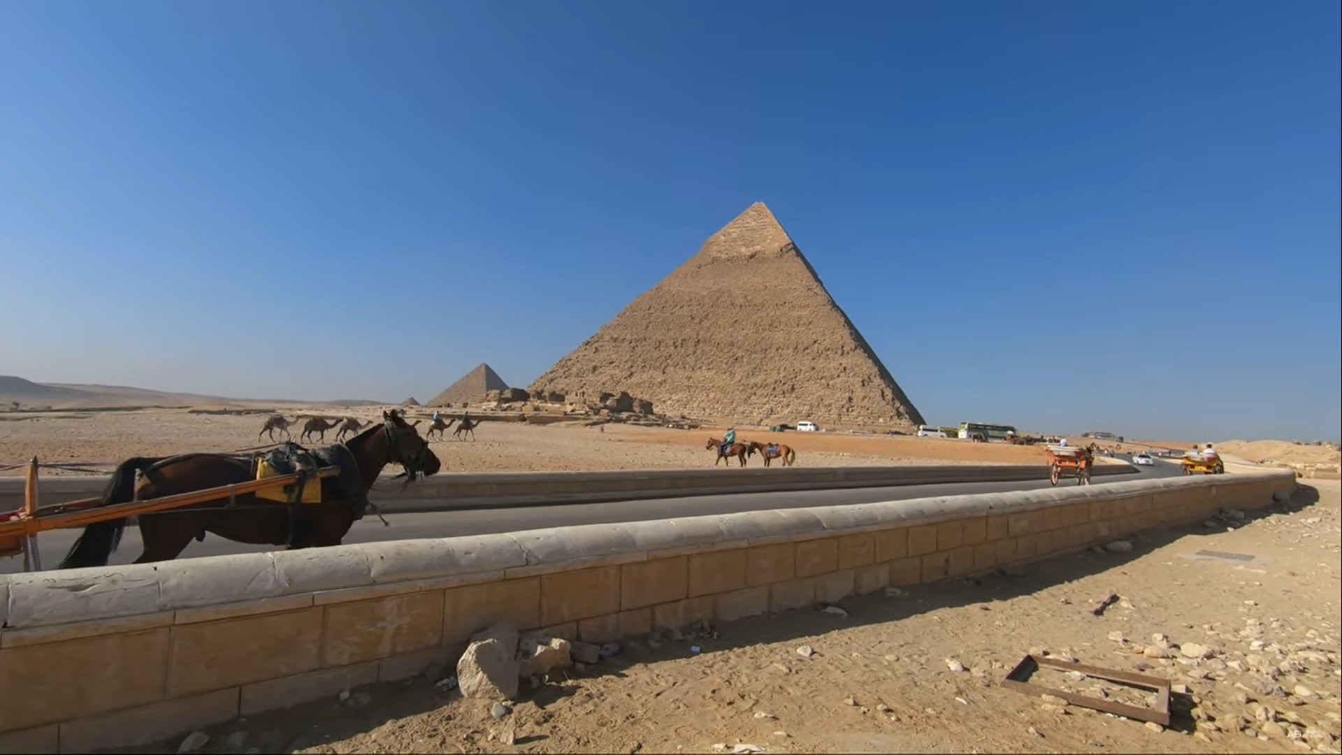 Giza plateau at dawn with the desert and pyramids on the horizon